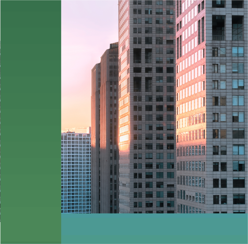 photo of a city skyline at dusk where the sun is setting behind a series of skyscapers.