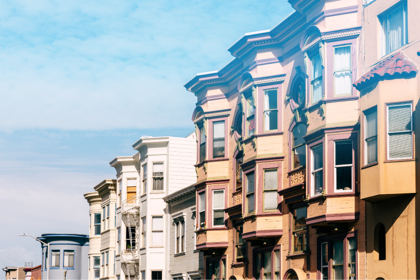 Colorful victorian houses under blue sky